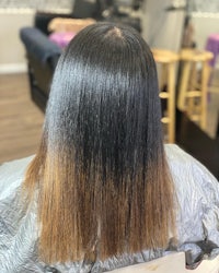 the back of a woman's hair in a salon