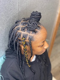 a woman with braided hair in a salon