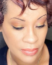 a close up of a woman with curly hair