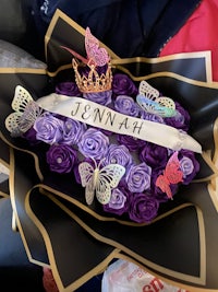 a purple flower bouquet with a purple tiara