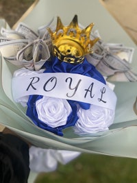 a bouquet of money with the word royal written on it